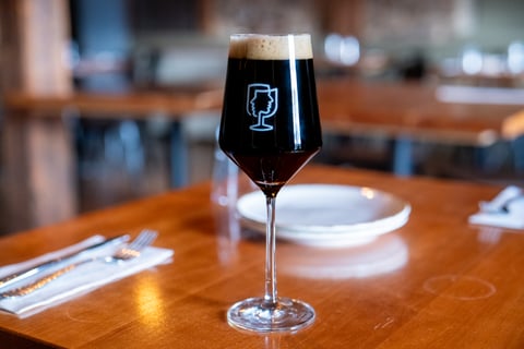 Overshadow Porter poured dark in a stemmed Concordance Ferments glass