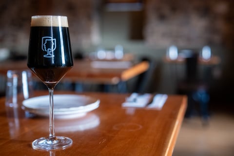 Homestead Bière de Garde poured in a stemmed Concordance Ferments glass