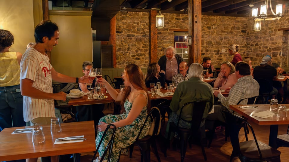 Guests seated in the stone-walled dining room at Concordance Ferments in Hatboro, PA